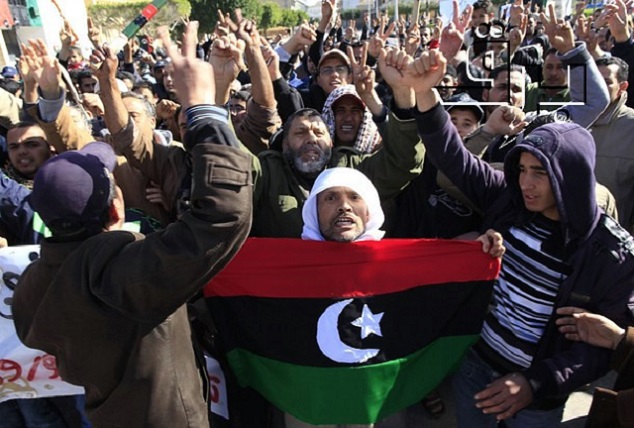 Protesters opposed to leader Muammar Gaddafi chant slogans in the city of Zawiyah