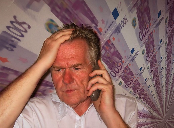 man-face-phone-despair