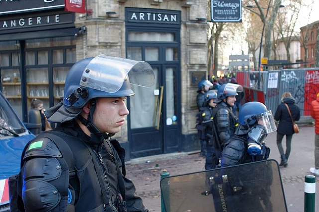 man-wearing-blue-riot-helmet
