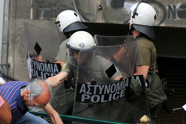 640px-20110629_Old_man_hit_by_Riot_Police_in_demonstrations_in_Athens_Greece